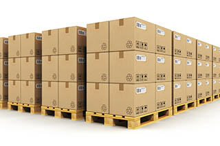 Warehouse with cardbaord boxes on shipping pallets